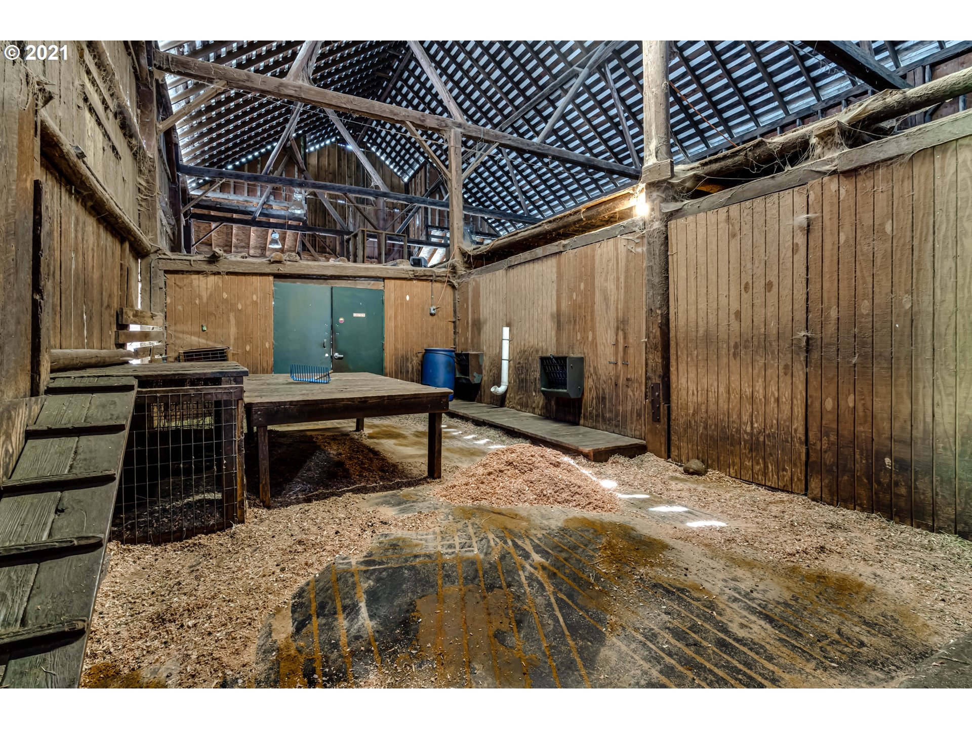 79385 Sears Road Cottage Grove, OR 97424 - Photo 28 of 32 a bedroom with a bed and a chandelier