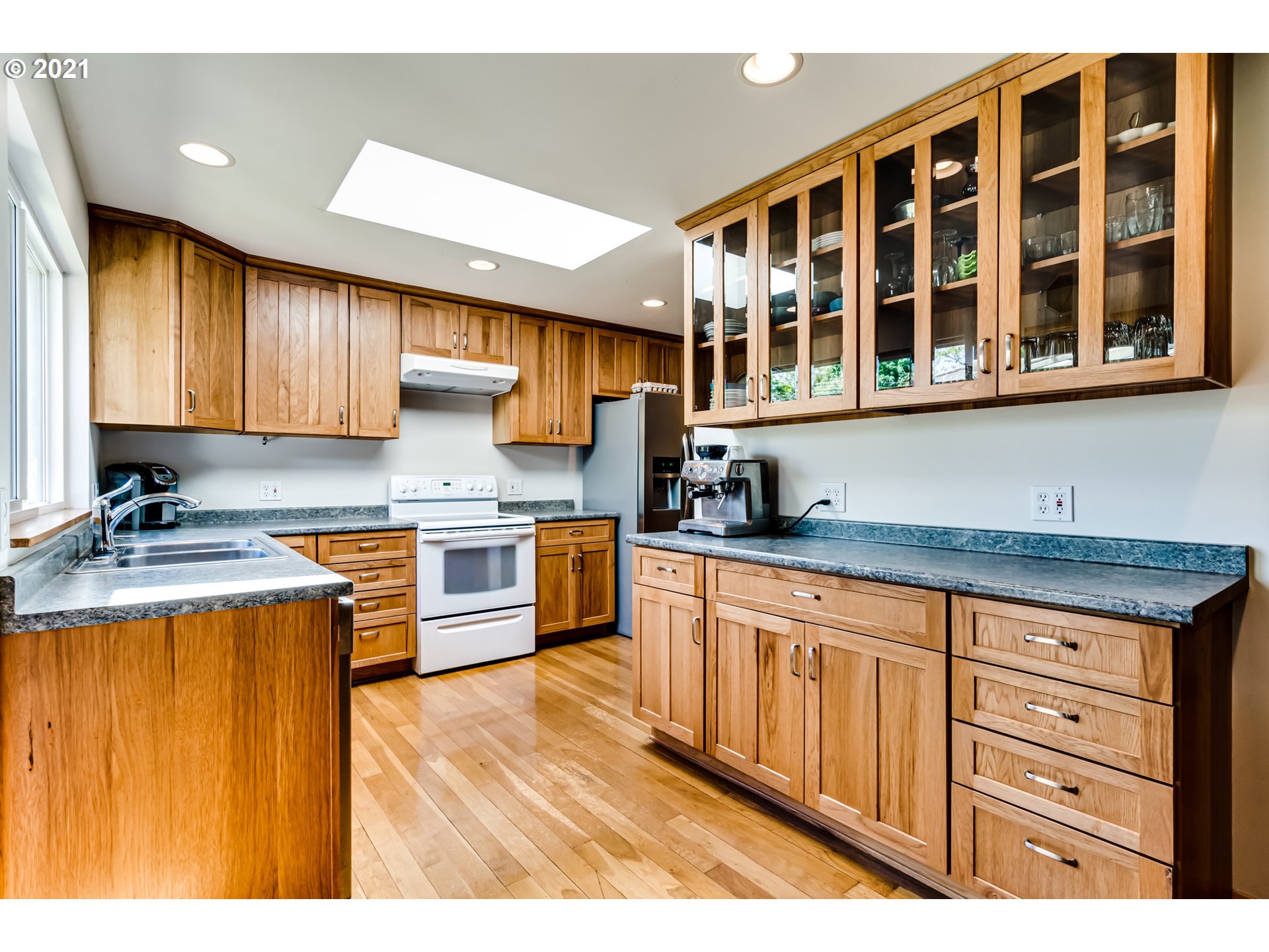 79385 Sears Road Cottage Grove, OR 97424 - Photo 5 of 32 a kitchen with granite countertop a sink stove and cabinets