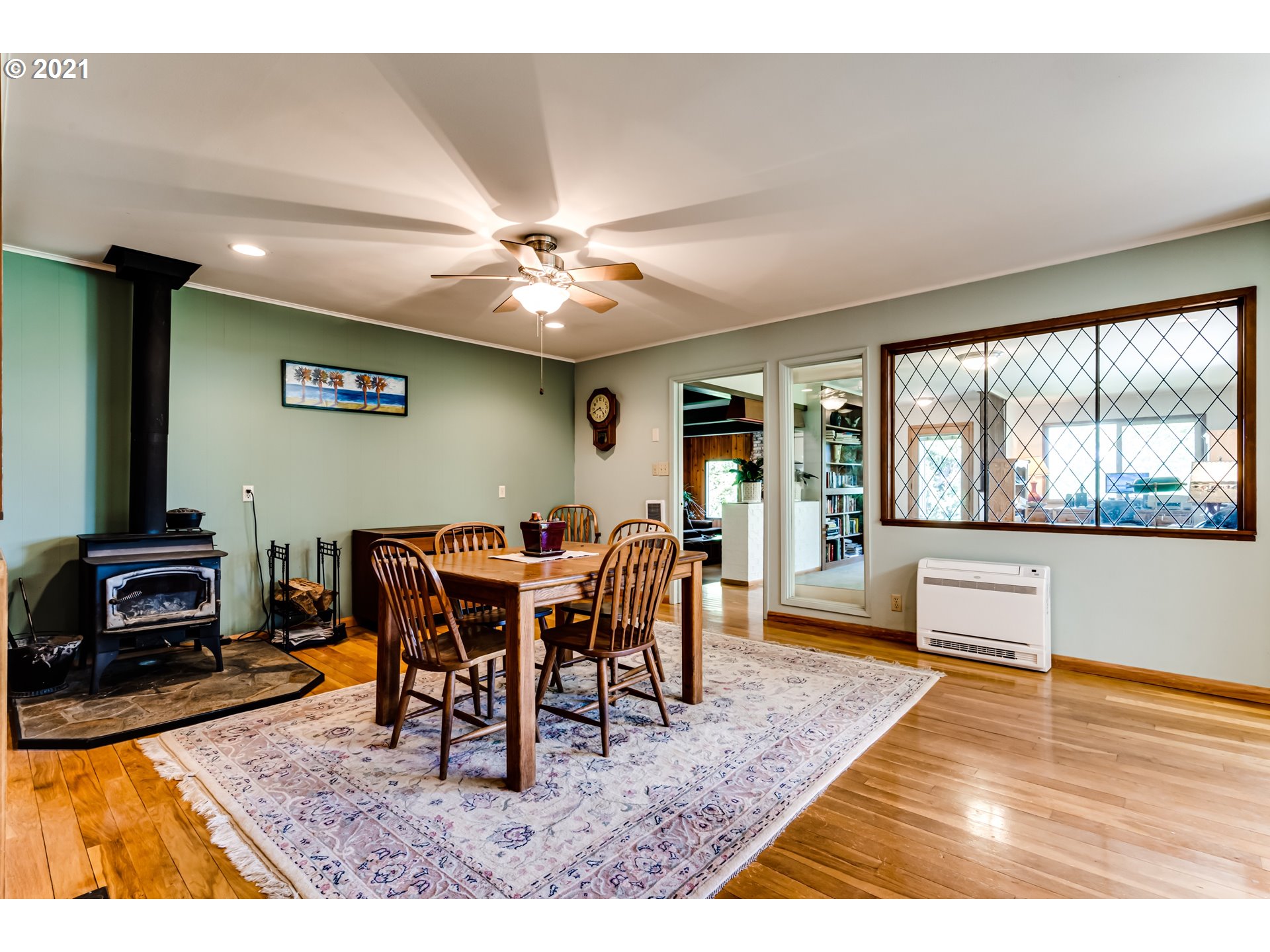 79385 Sears Road Cottage Grove, OR 97424 - Photo 6 of 32 a view of a dining room with furniture window and wooden floor