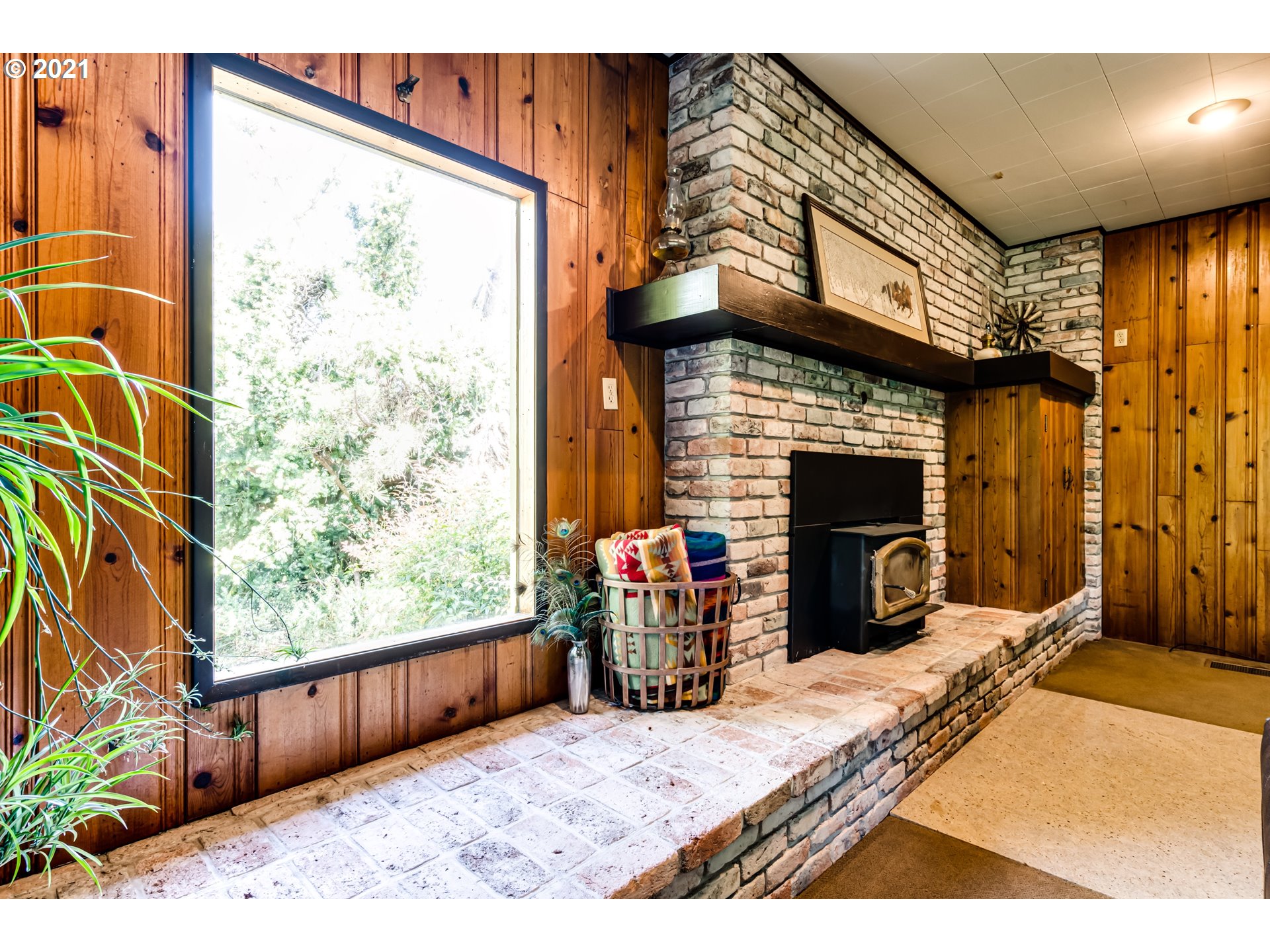 79385 Sears Road Cottage Grove, OR 97424 - Photo 9 of 32 a bedroom with a bed and a fireplace