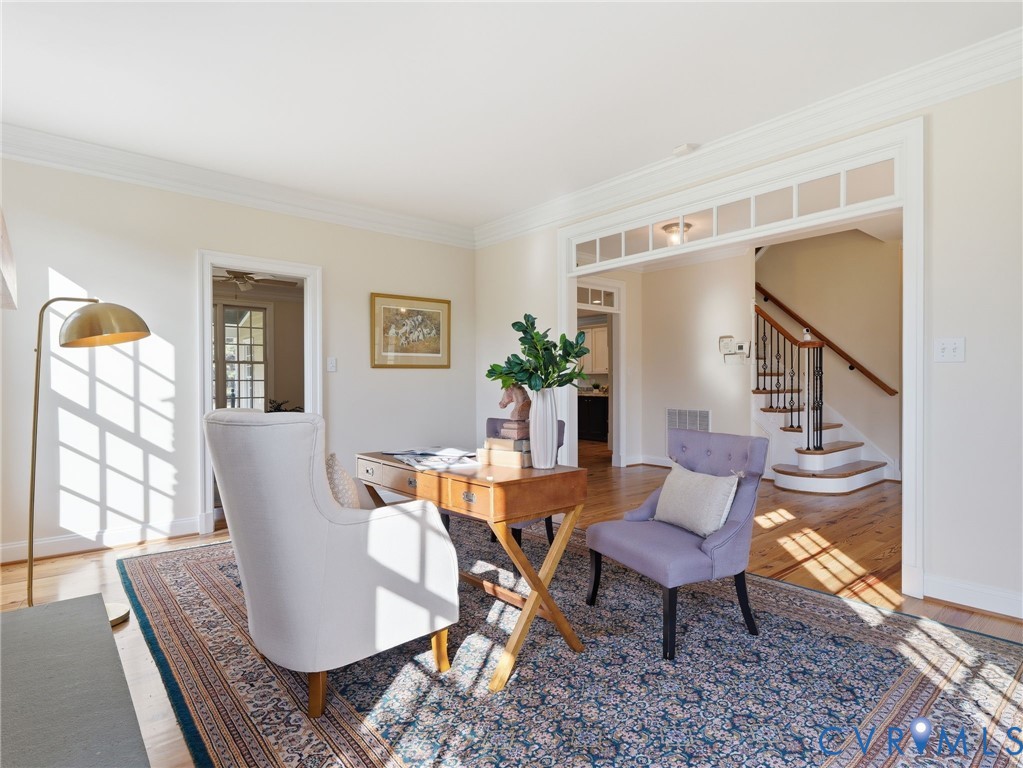 2880 Millmount Parkway Powhatan, VA 23139 - Photo 11 of 36 a dining room with furniture a rug and wooden floor