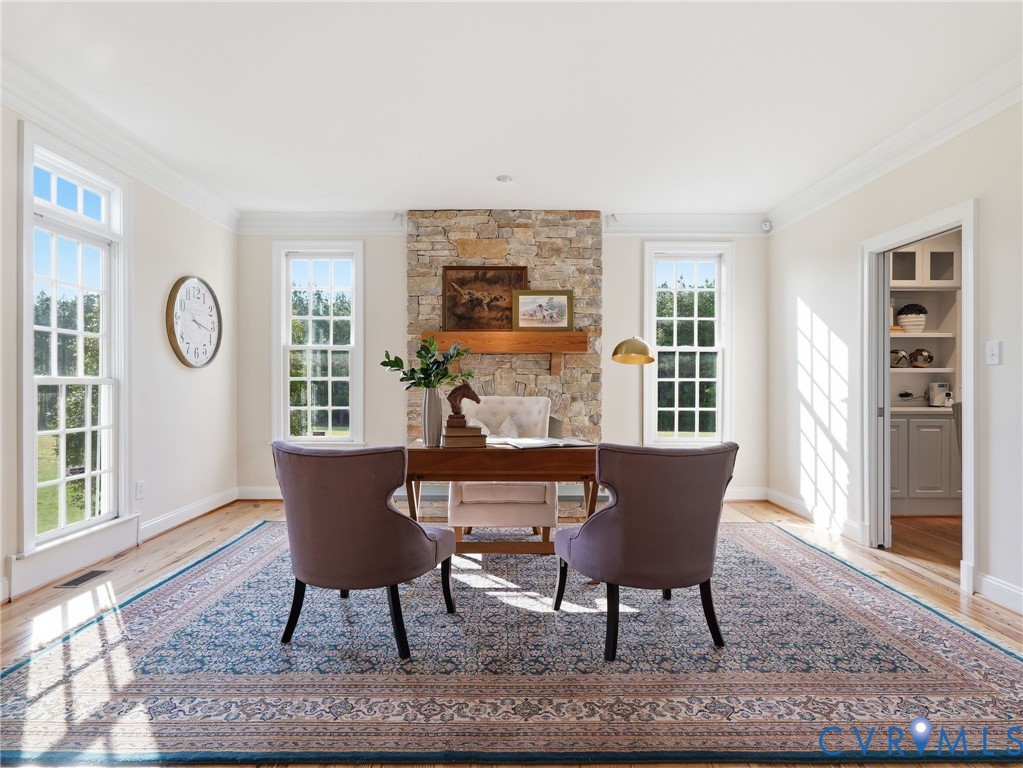 2880 Millmount Parkway Powhatan, VA 23139 - Photo 15 of 36 a dining room with furniture a rug and wooden floor