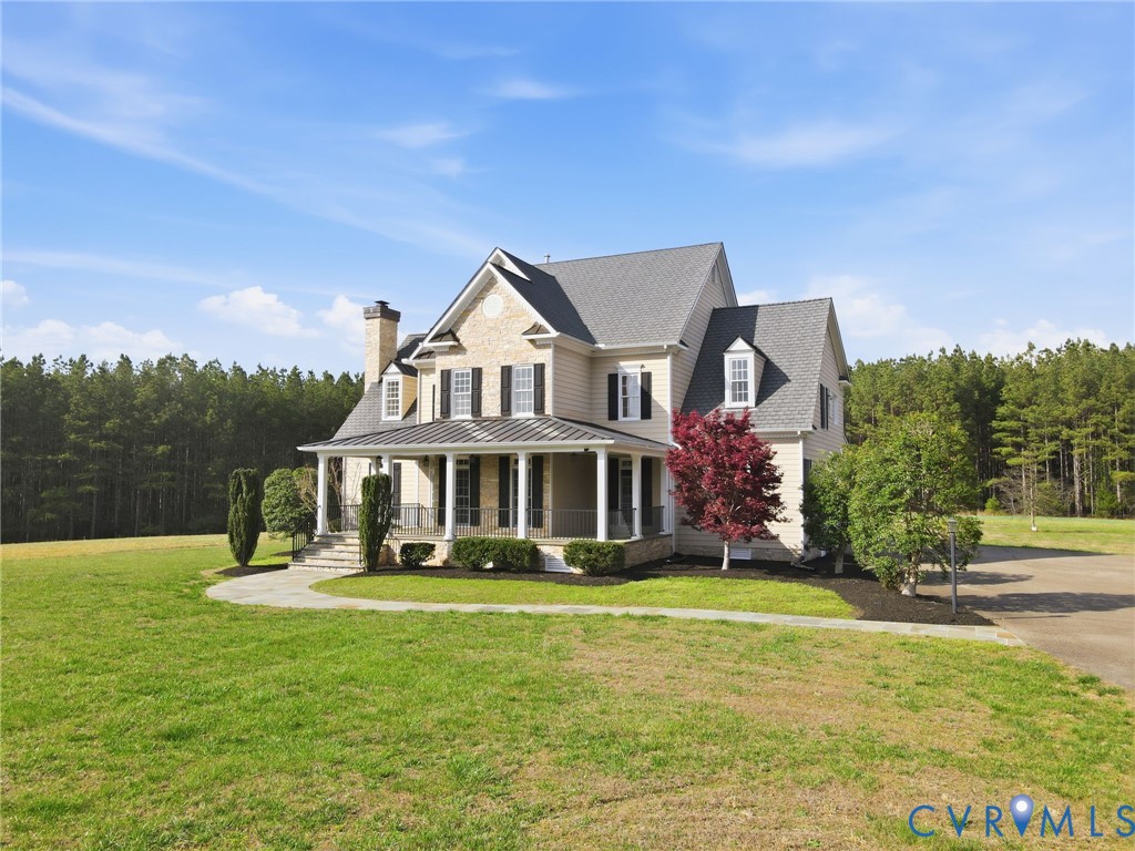 2880 Millmount Parkway Powhatan, VA 23139 - Photo 27 of 36 a front view of a house with garden