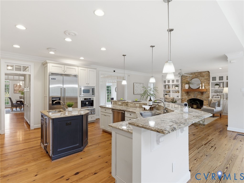 2880 Millmount Parkway Powhatan, VA 23139 - Photo 5 of 36 a open kitchen with stainless steel appliances granite countertop a stove and cabinets