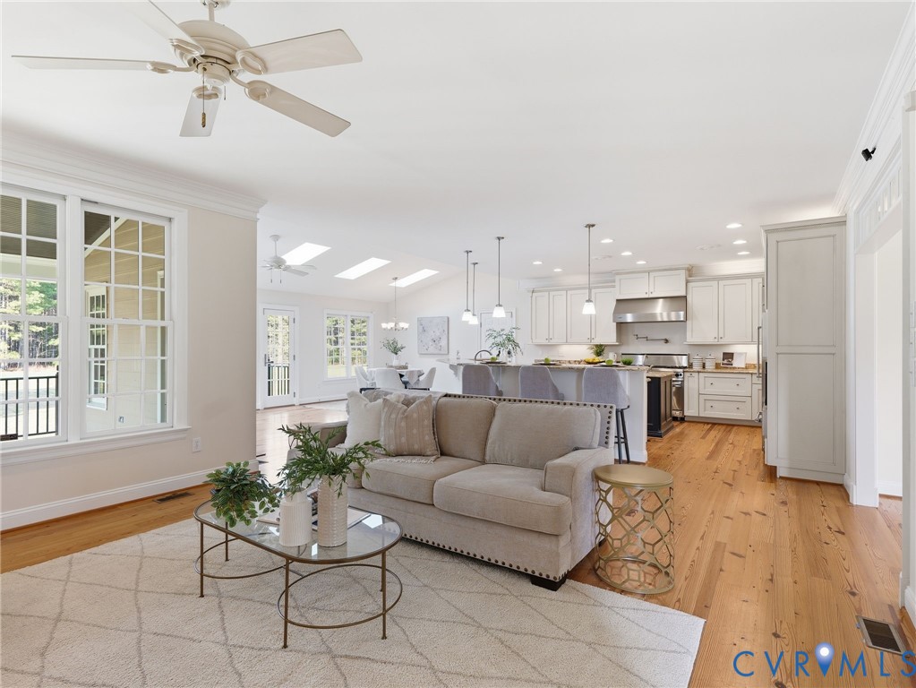 2880 Millmount Parkway Powhatan, VA 23139 - Photo 8 of 36 a living room with furniture and kitchen view