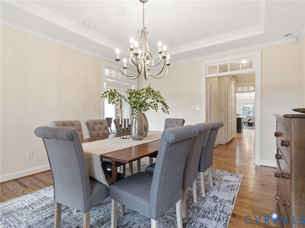 2880 Millmount Parkway Powhatan, VA 23139 - Photo 10 of 36 a view of a dining room with furniture and chandelier
