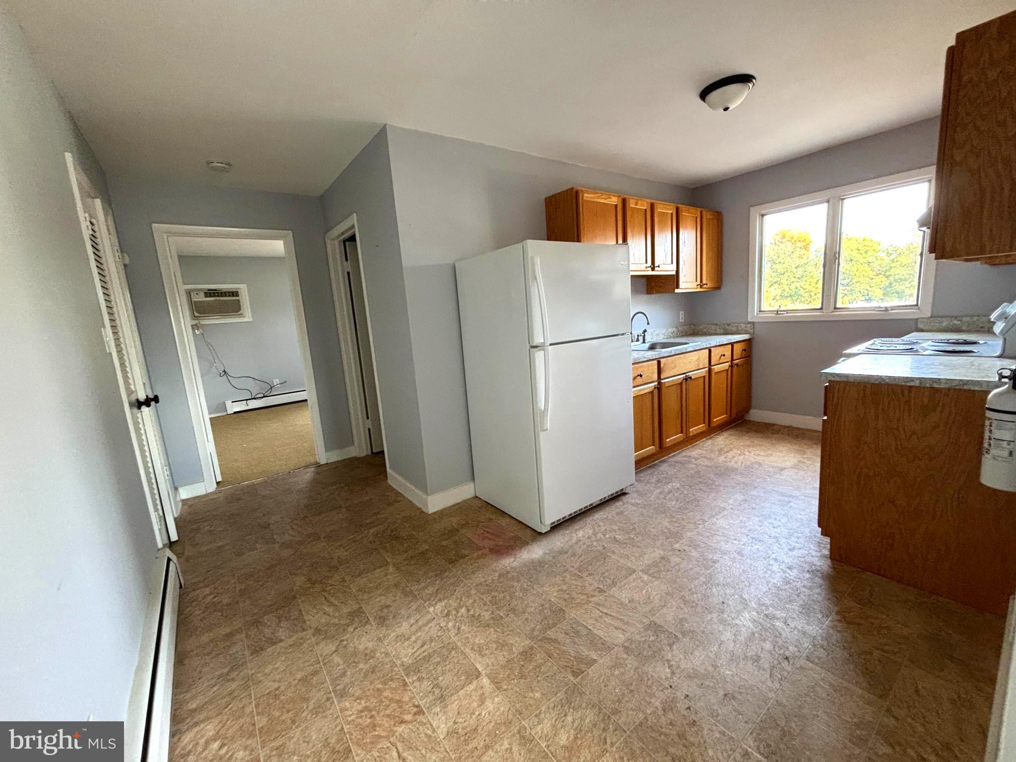 43 South Main Street Woodstown, NJ 08098 - Photo 1 of 13 a view of kitchen with refrigerator and window