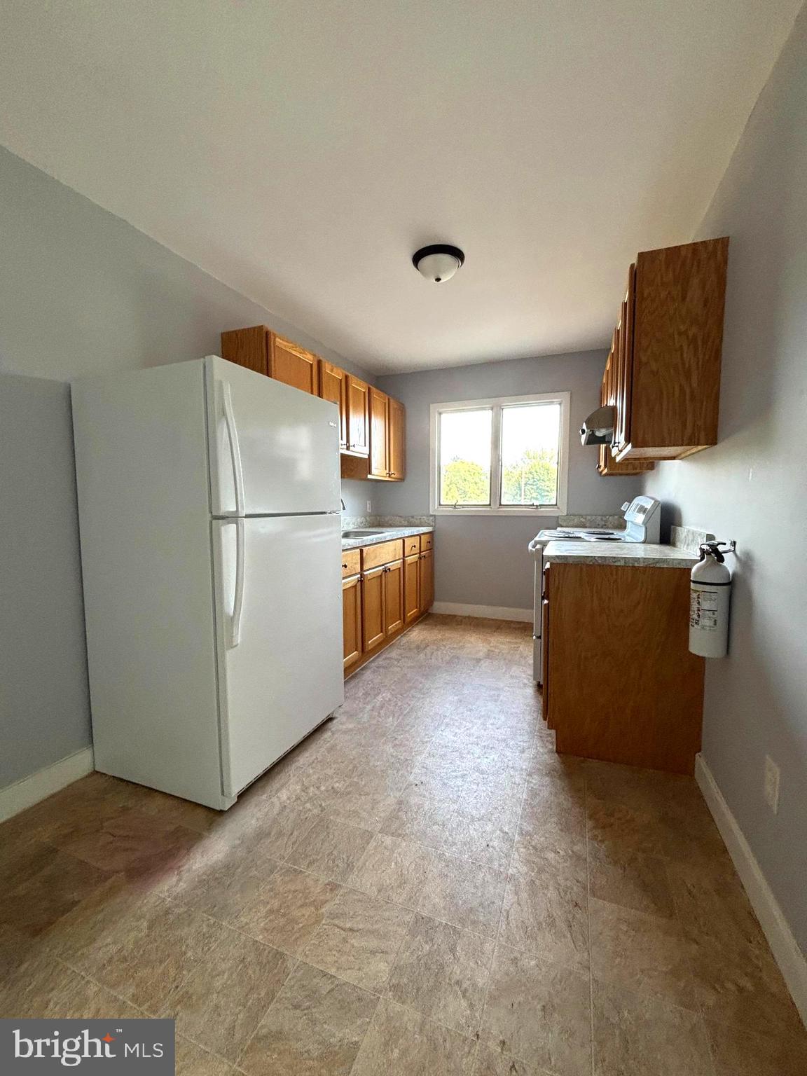 43 South Main Street Woodstown, NJ 08098 - Photo 2 of 13 a kitchen with refrigerator and window
