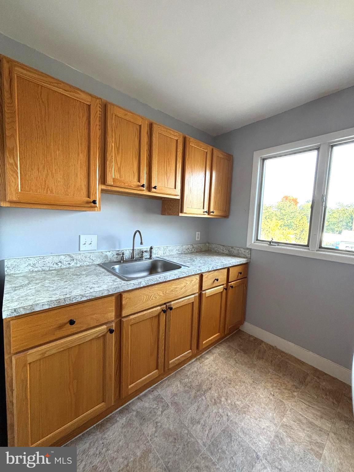 43 South Main Street Woodstown, NJ 08098 - Photo 3 of 13 a kitchen with granite countertop a sink cabinets and window