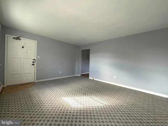 a view of an empty room and window