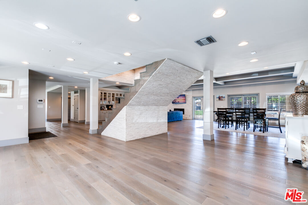 17153 Rayen Street Northridge, CA 91325 - Photo 12 of 47 a view of empty room with wooden floor