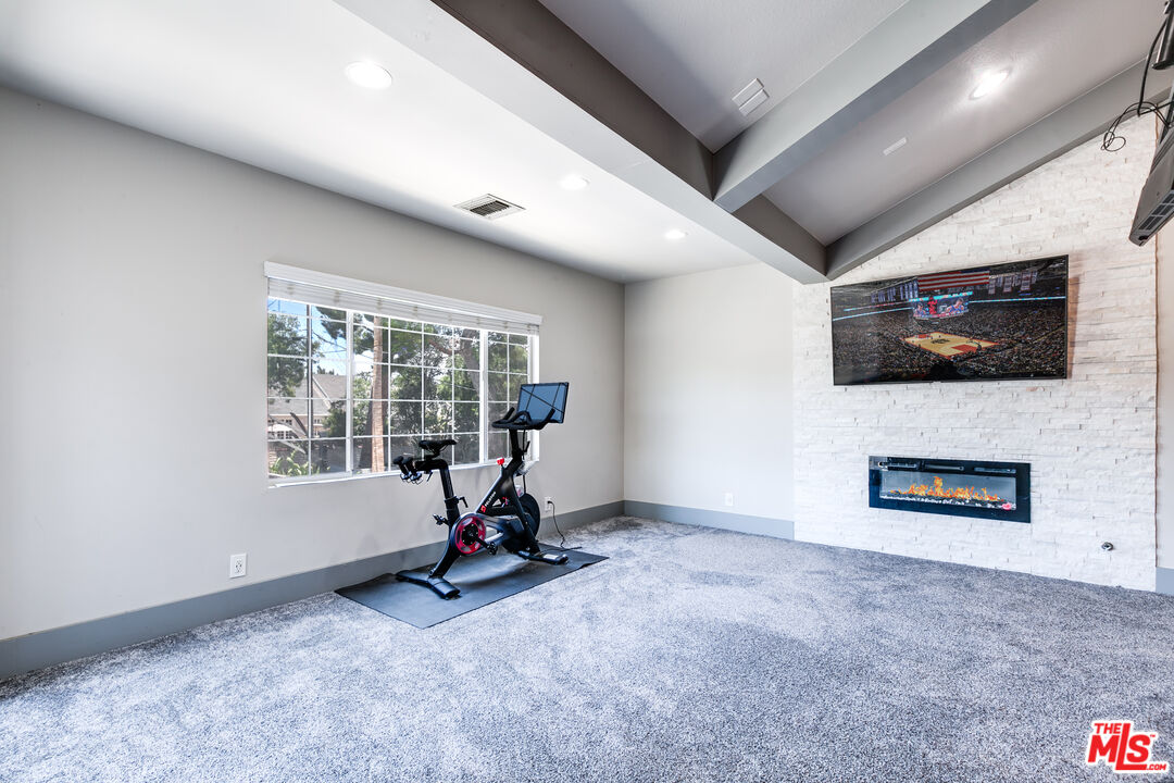 17153 Rayen Street Northridge, CA 91325 - Photo 32 of 47 a view of a room with gym equipment