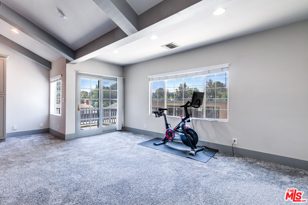 17153 Rayen Street Northridge, CA 91325 - Photo 33 of 47 a view of a room with gym equipment