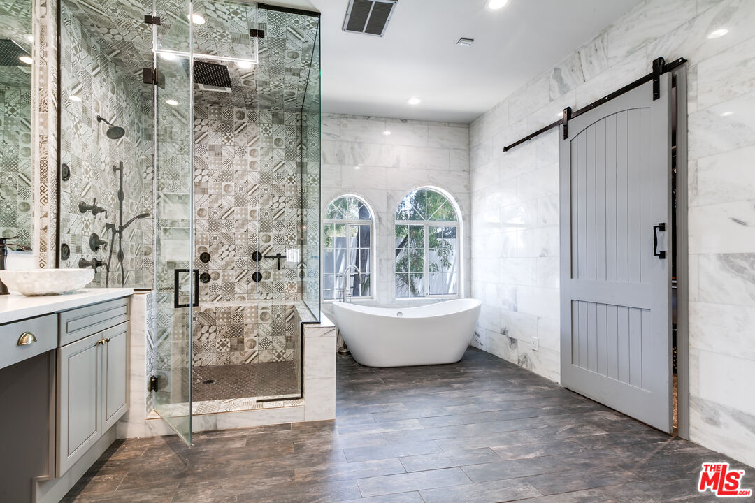 17153 Rayen Street Northridge, CA 91325 - Photo 34 of 47 a very nice looking bathroom with a bathtub and shower