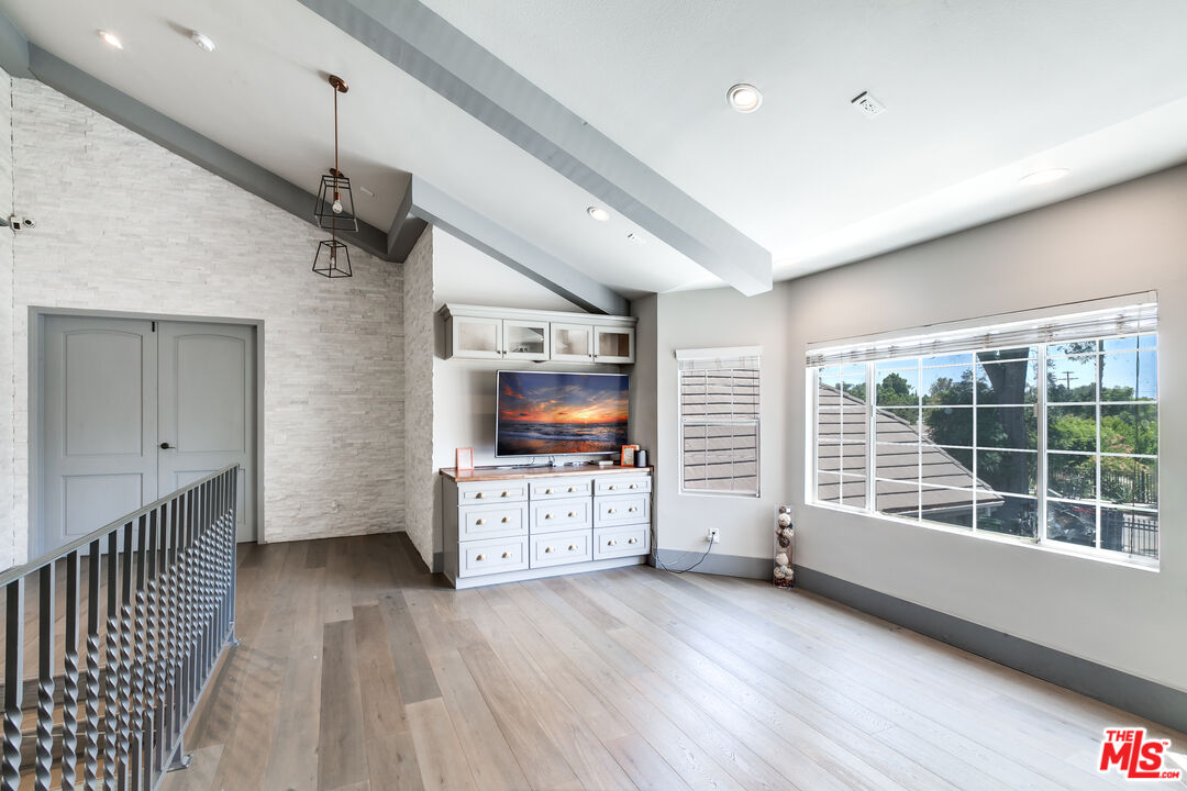 17153 Rayen Street Northridge, CA 91325 - Photo 43 of 47 a view of a livingroom with furniture wooden floor and window