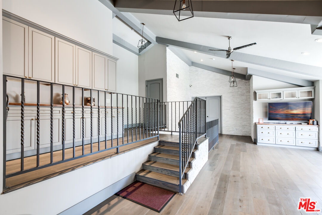 17153 Rayen Street Northridge, CA 91325 - Photo 44 of 47 a view of entryway and hall with wooden floor