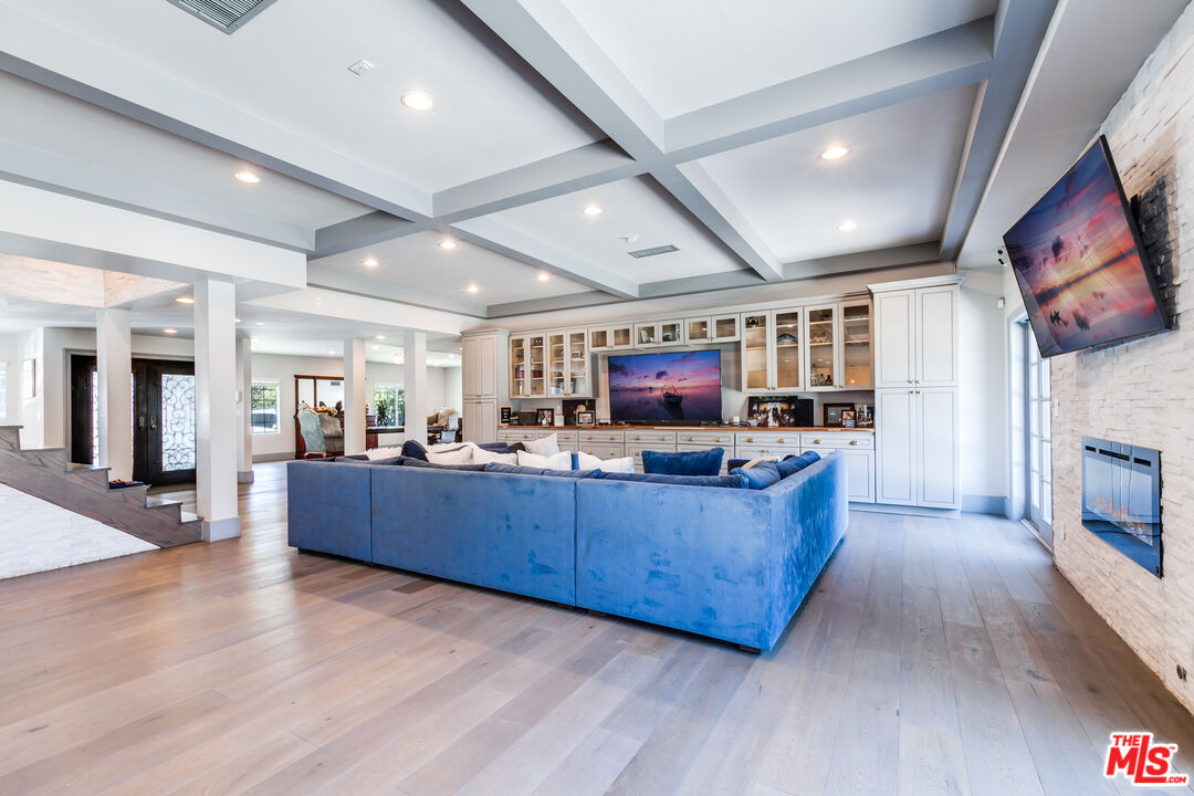 17153 Rayen Street Northridge, CA 91325 - Photo 5 of 47 a living room with furniture and a wooden floor