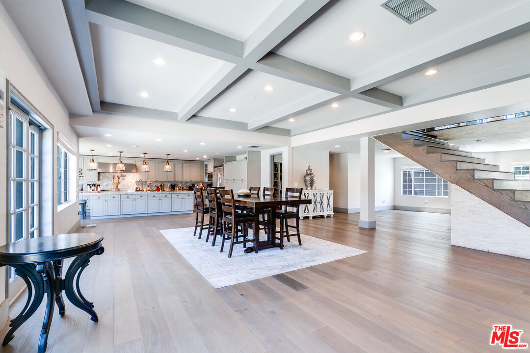 17153 Rayen Street Northridge, CA 91325 - Photo 7 of 47 a view of a dining room with furniture and wooden floor