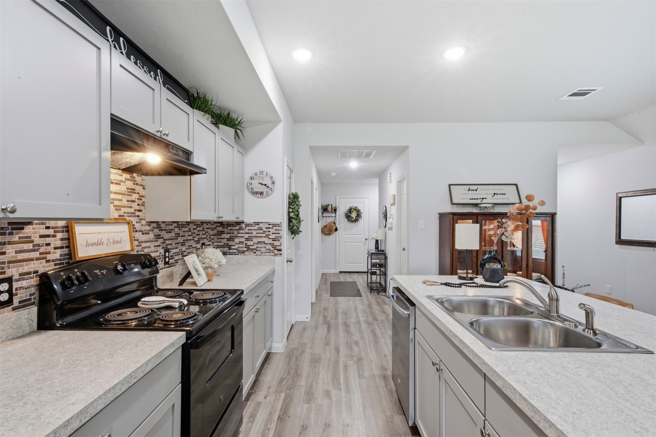 1523 22nd Street Hempstead, TX 77445 - Photo 6 of 26 Functional kitchen layout with stainless appliances and easy access to dining and living spaces.