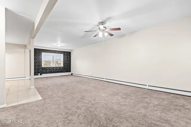 an empty room with a empty space and windows