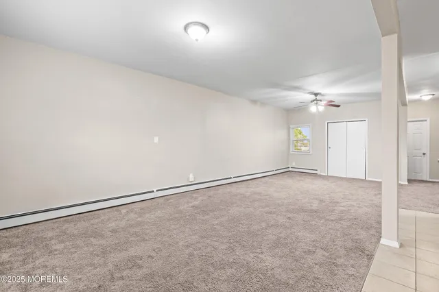 a view of kitchen with furniture and refrigerator