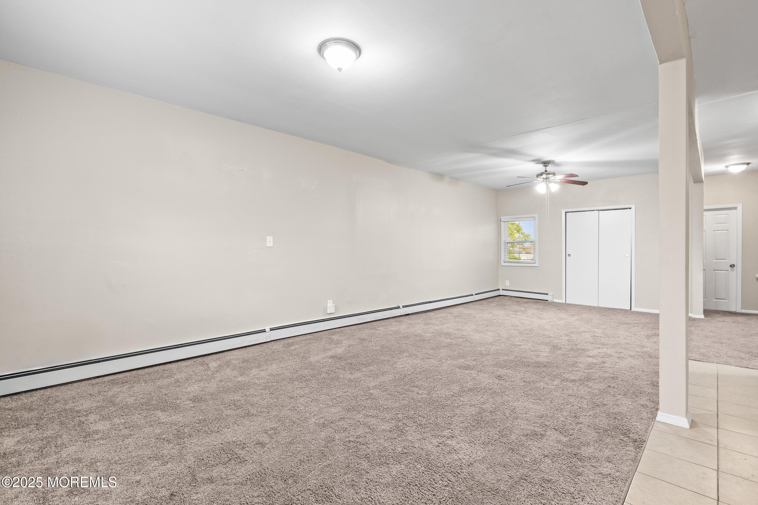 8 West End Court Long Branch, NJ 07740 - Photo 12 of 45 an empty room with a empty space and windows