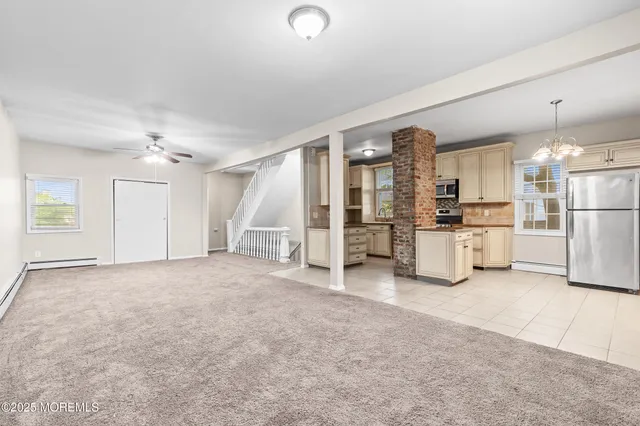 a kitchen with stainless steel appliances a refrigerator sink and stove