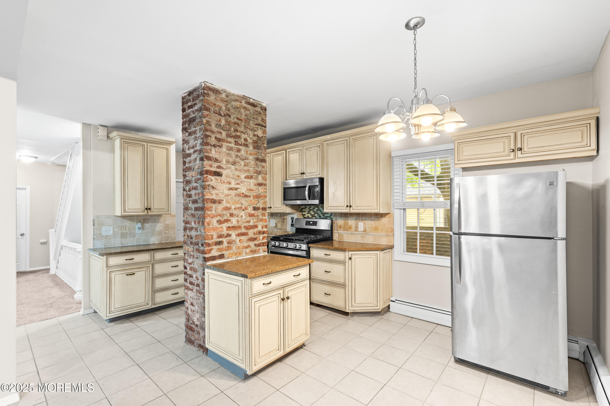 8 West End Court Long Branch, NJ 07740 - Photo 15 of 45 a kitchen with stainless steel appliances a refrigerator sink and stove