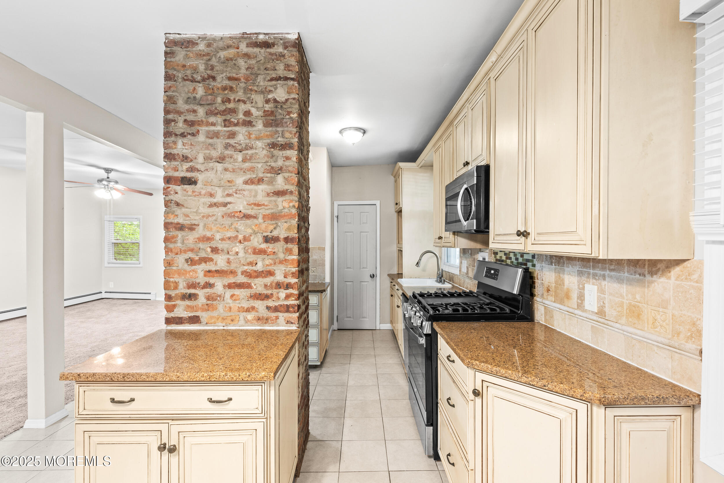 8 West End Court Long Branch, NJ 07740 - Photo 17 of 45 a kitchen with stainless steel appliances kitchen island granite countertop a refrigerator and cabinets
