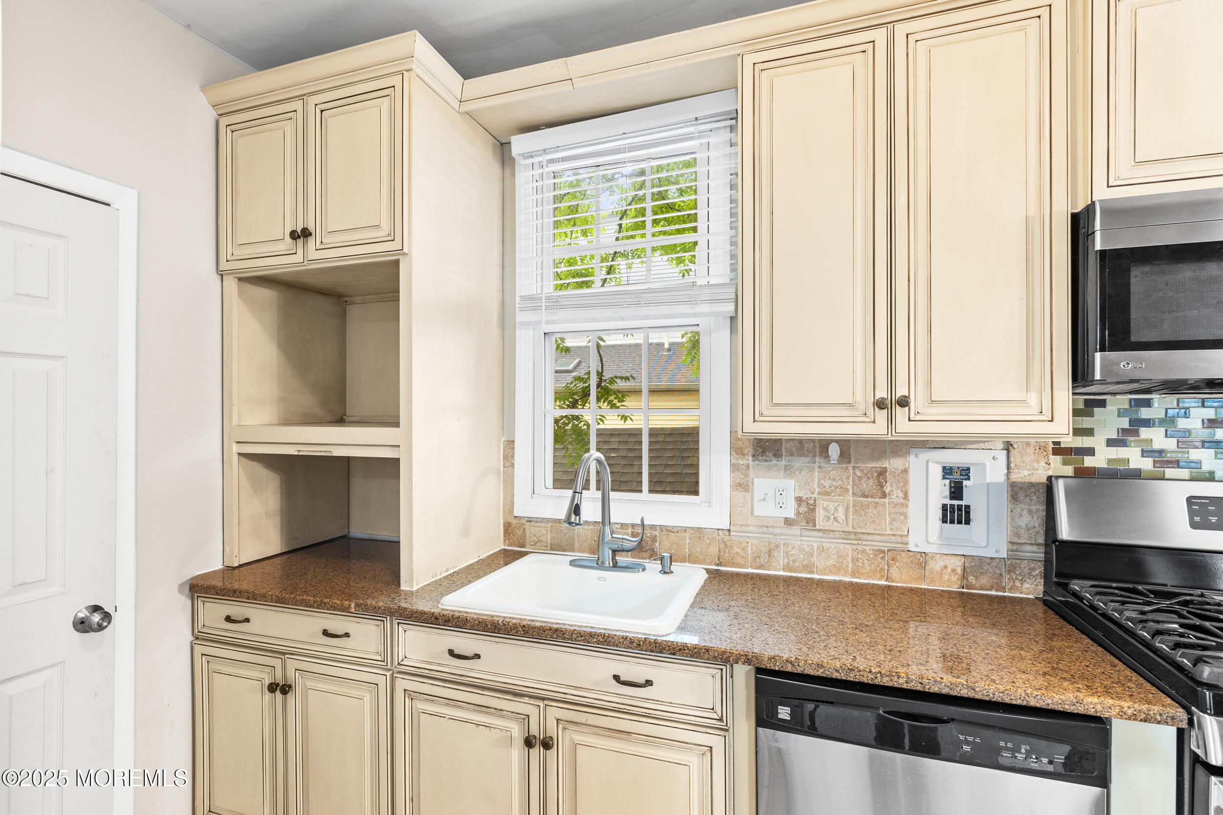 8 West End Court Long Branch, NJ 07740 - Photo 19 of 45 a kitchen with granite countertop a sink and a stove
