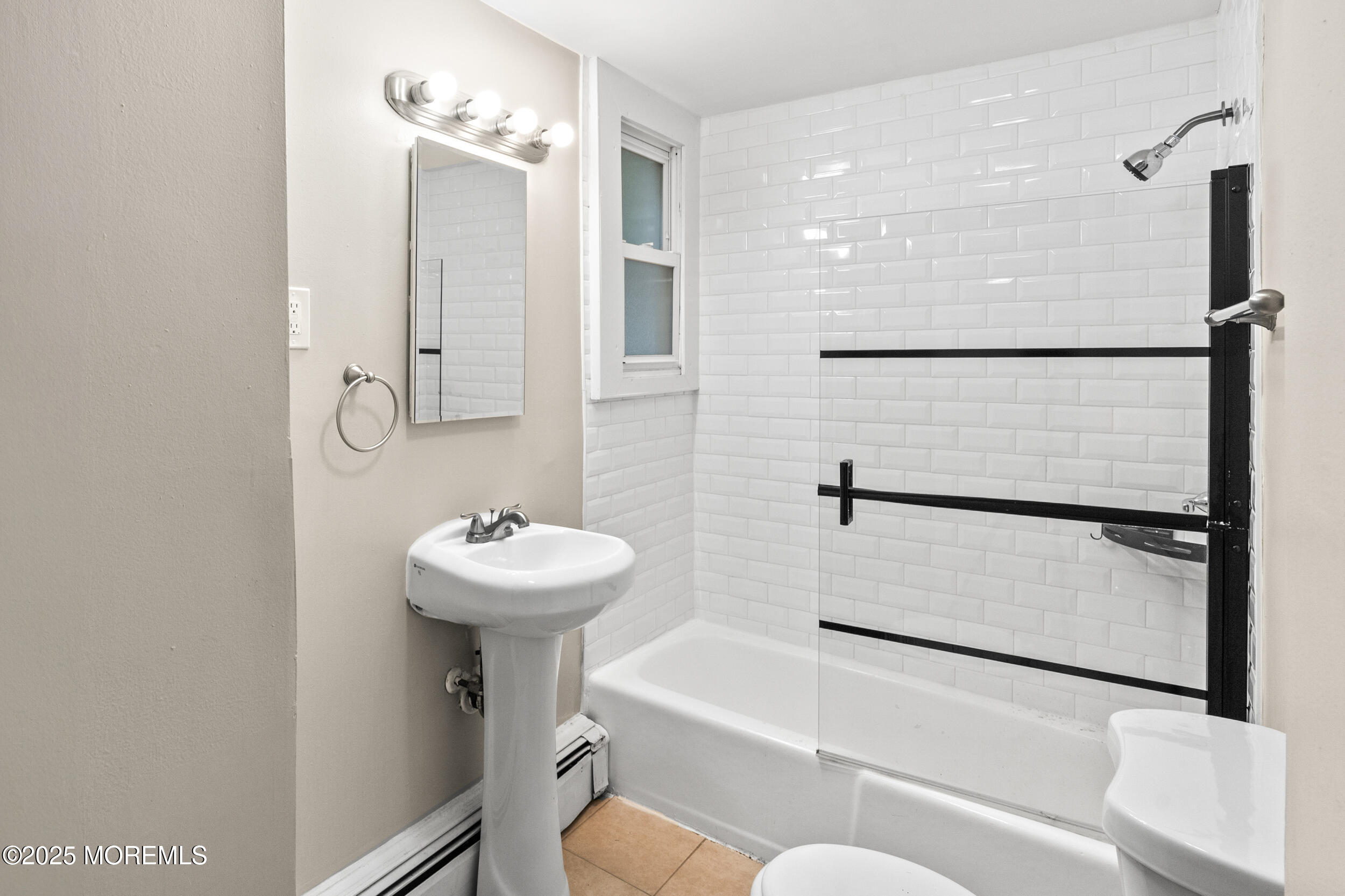 8 West End Court Long Branch, NJ 07740 - Photo 24 of 45 a bathroom with a sink mirror toilet and shower