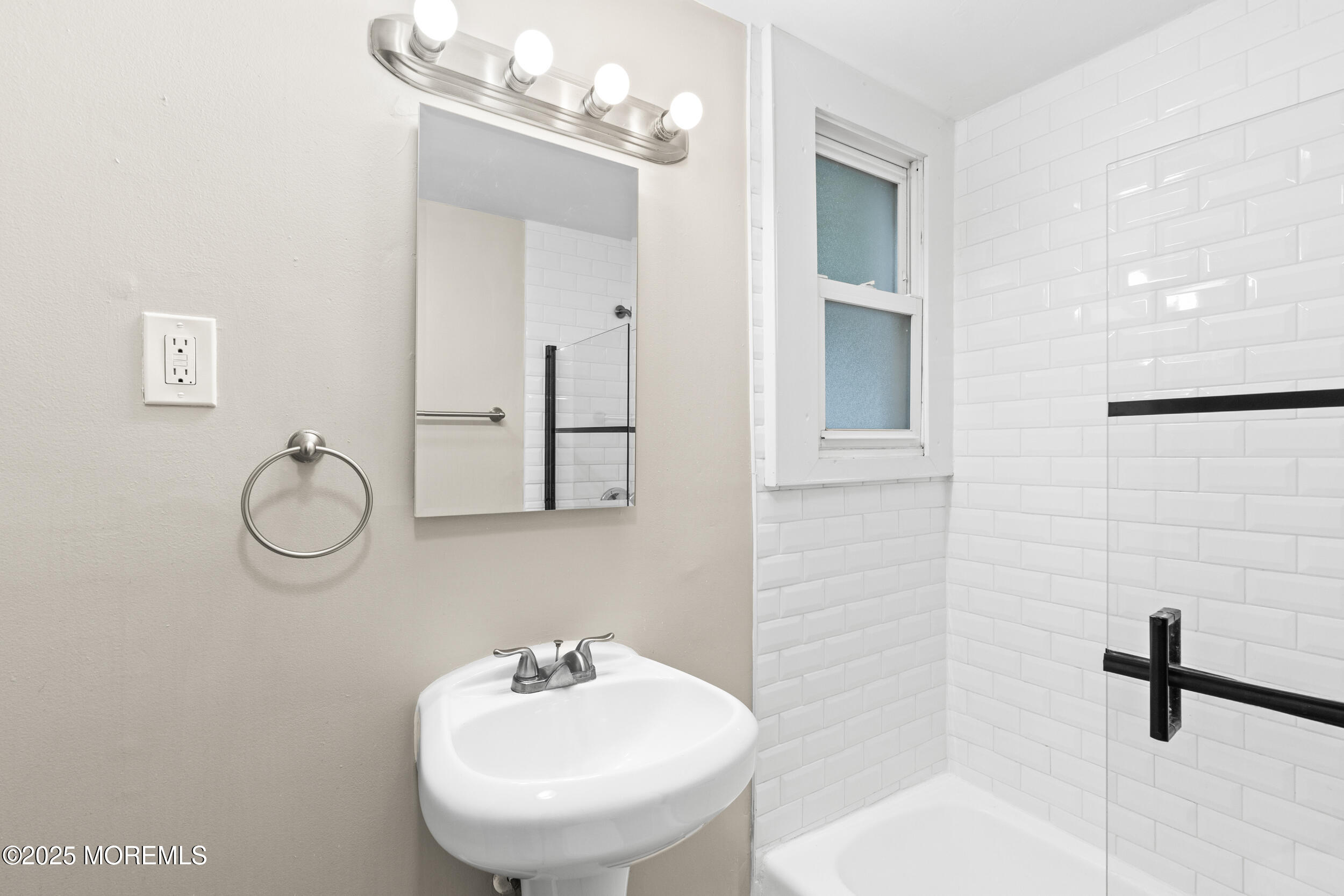 8 West End Court Long Branch, NJ 07740 - Photo 26 of 45 a bathroom with a sink and a mirror