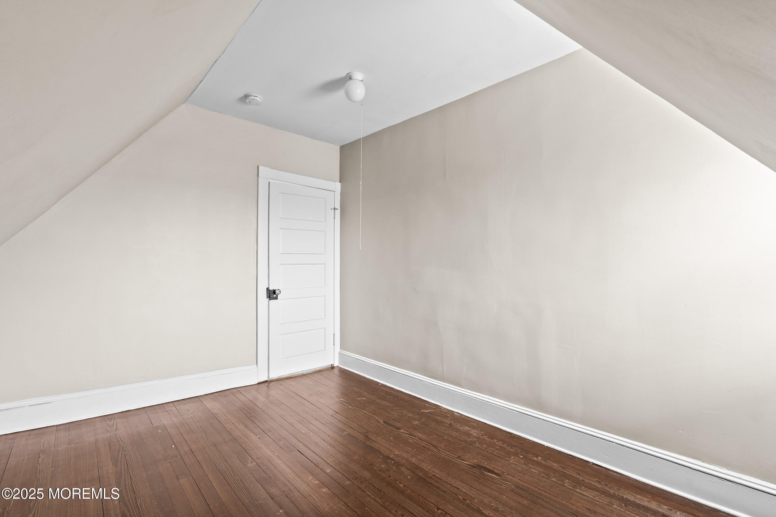 8 West End Court Long Branch, NJ 07740 - Photo 28 of 45 a view of an empty room with wooden floor