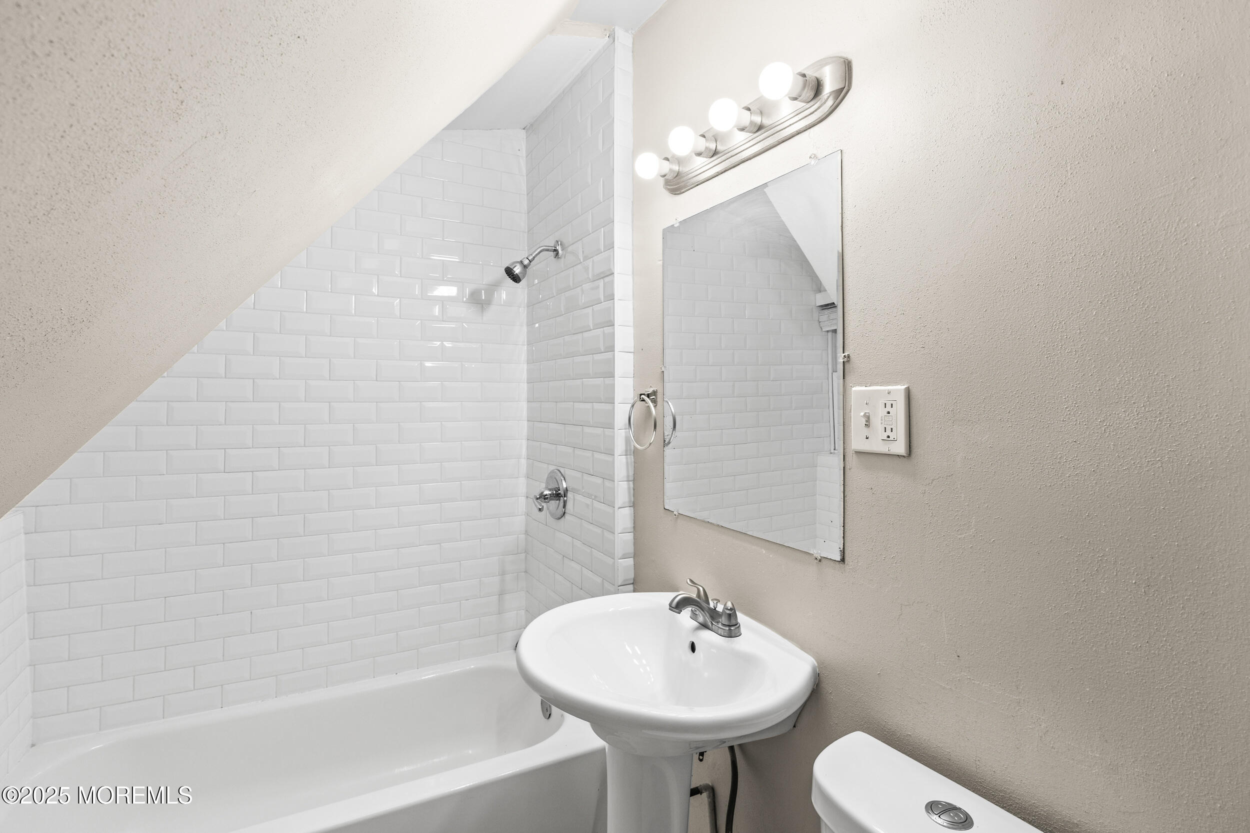 8 West End Court Long Branch, NJ 07740 - Photo 30 of 45 a bathroom with a sink a toilet and shower