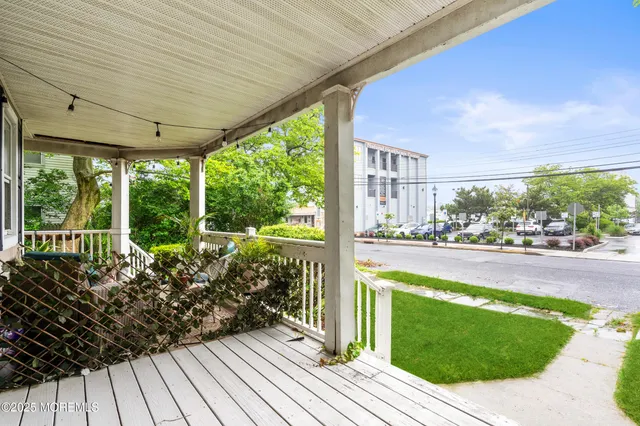 a view of a living room and floor to ceiling window or hardwood floor