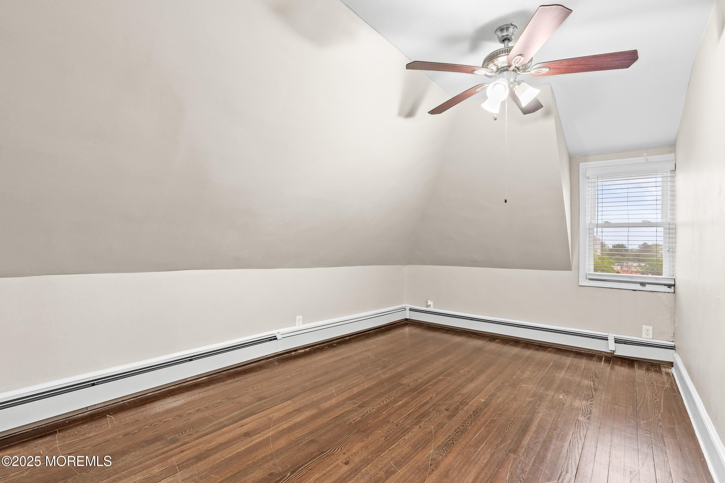 8 West End Court Long Branch, NJ 07740 - Photo 31 of 45 wooden floor in an empty room with a window