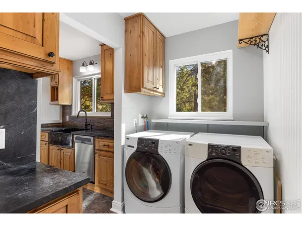 a kitchen with sink and cabinets