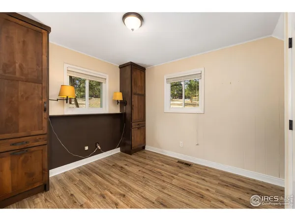 a view of kitchen with wooden floor and window