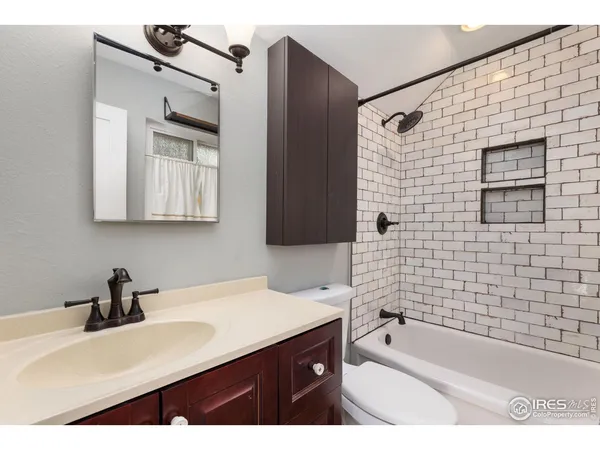 a bathroom with a sink a bathtub and a shower