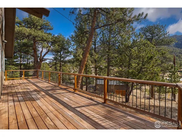 a view of balcony with wooden floor