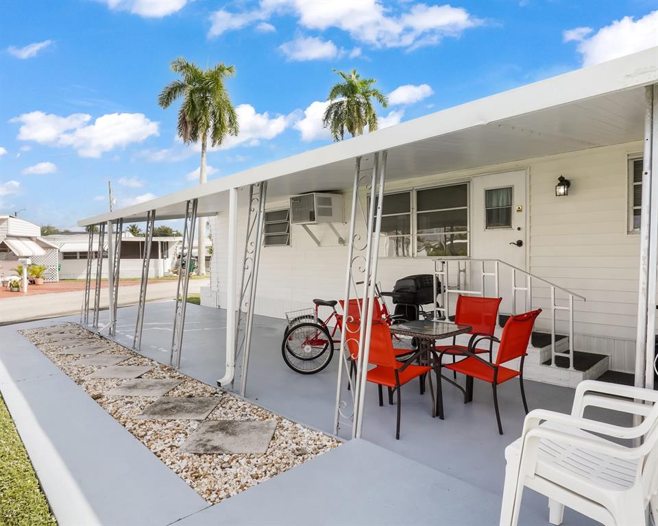 Park City Davie, FL 33324 - Photo 13 of 26 a view of a dinning table and chairs in patio of the house