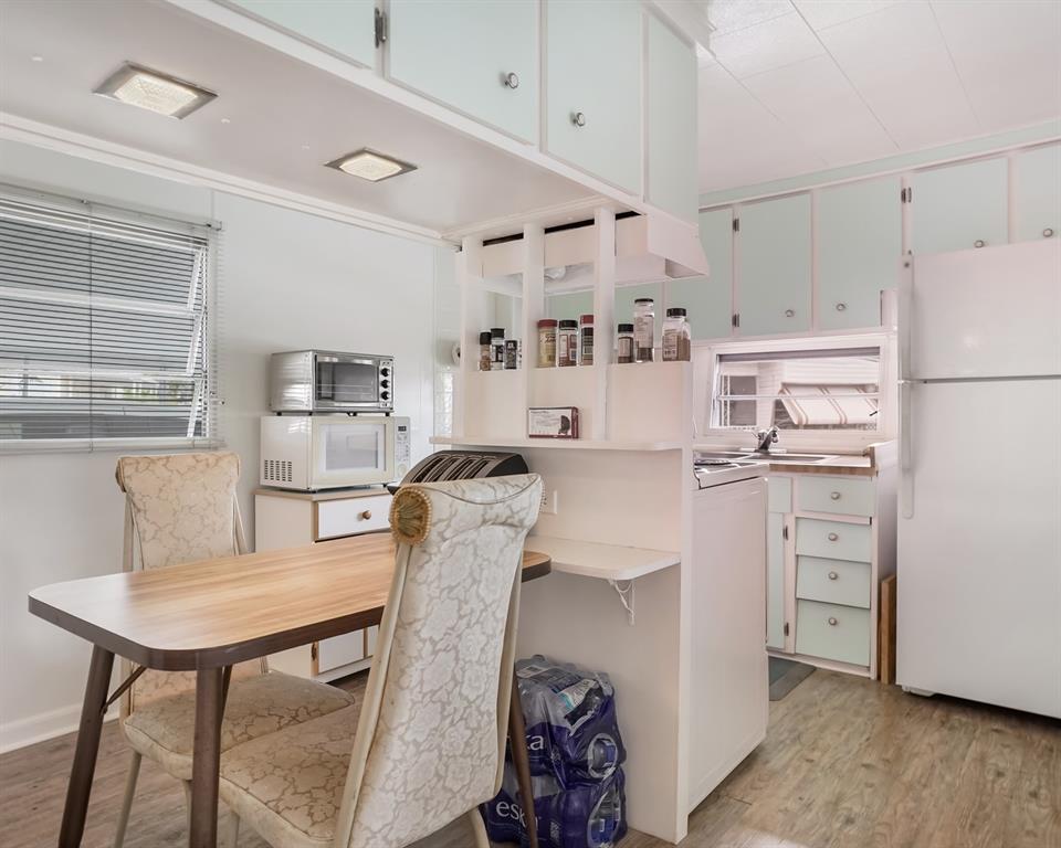 Park City Davie, FL 33324 - Photo 17 of 26 a kitchen with white cabinets and stainless steel appliances