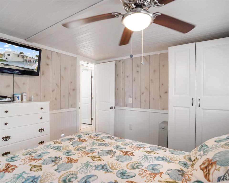 Park City Davie, FL 33324 - Photo 24 of 26 a bedroom with a bed and a chandelier fan