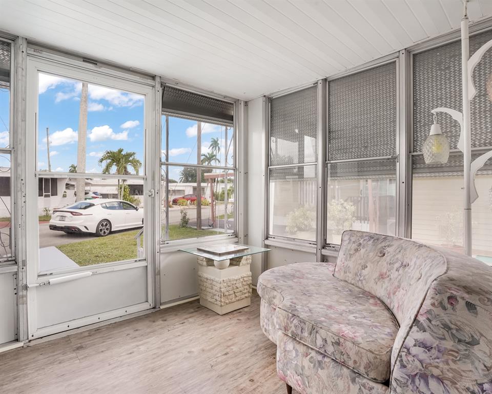 Park City Davie, FL 33324 - Photo 26 of 26 a living room with furniture and a large window with outer view