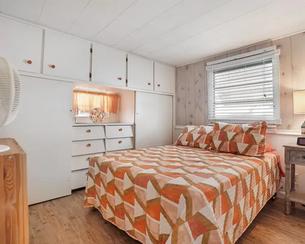 a bedroom with a bed and closet