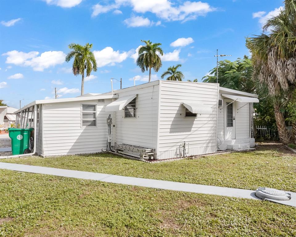 Park City Davie, FL 33324 - Photo 9 of 26 a view of a house with a yard