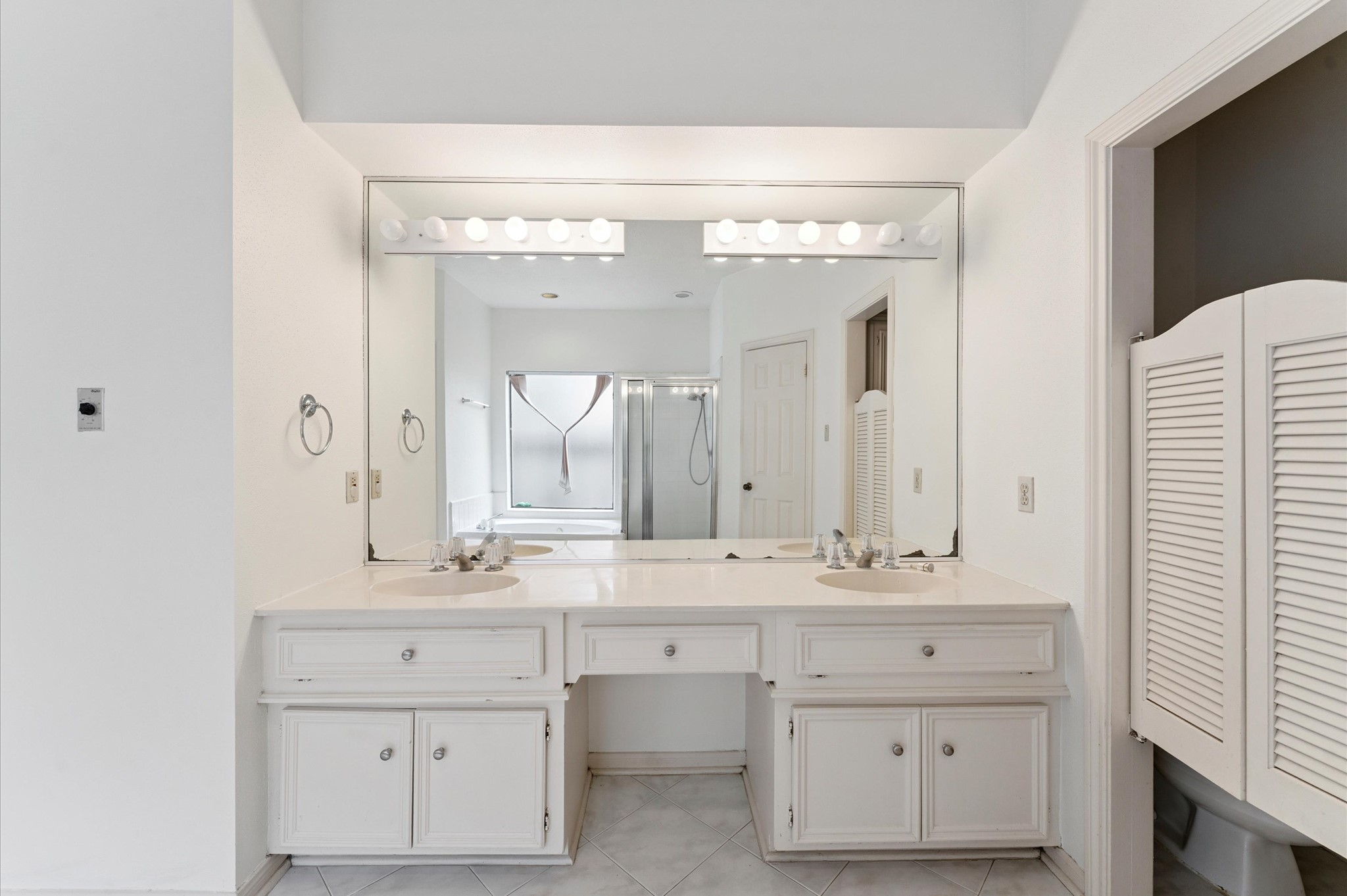 8015 Democracy Court Spring, TX 77379 - Photo 12 of 21 a bathroom with a sink vanity and mirror