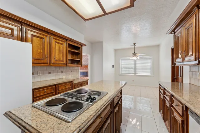 a kitchen with a stove and a sink