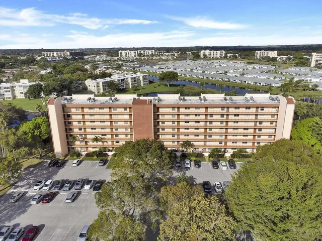 a view of a house with porch and garden