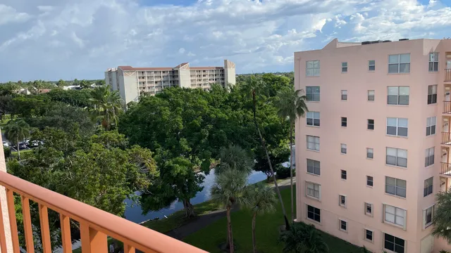 a view of a swimming pool with outdoor seating